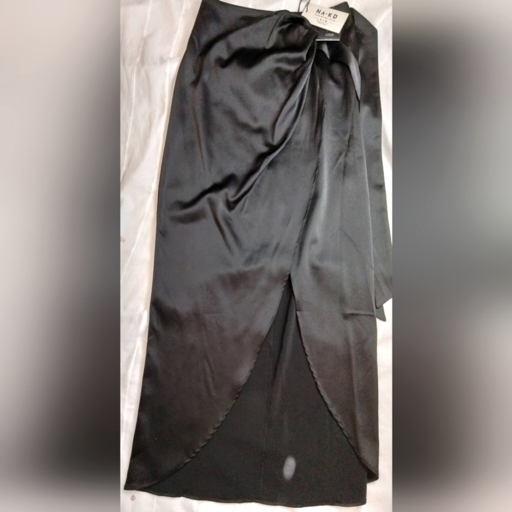 Gorgeous black wrap around skirt. New with tags! Size 34